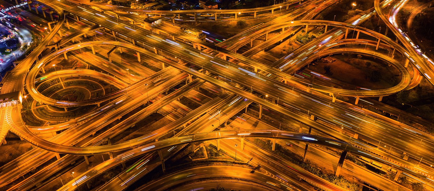 aerial-view-traffic-massive-highway-intersection-night